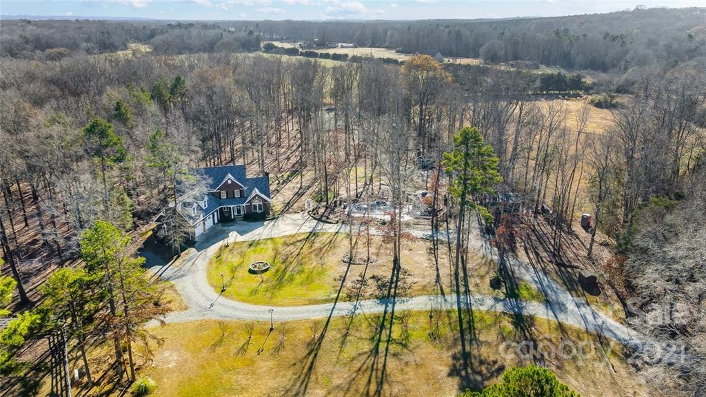 1517 Helms Shortcut Road Monroe, NC 28112 - Photo 2 of 45 a view of a swimming pool with a lake view