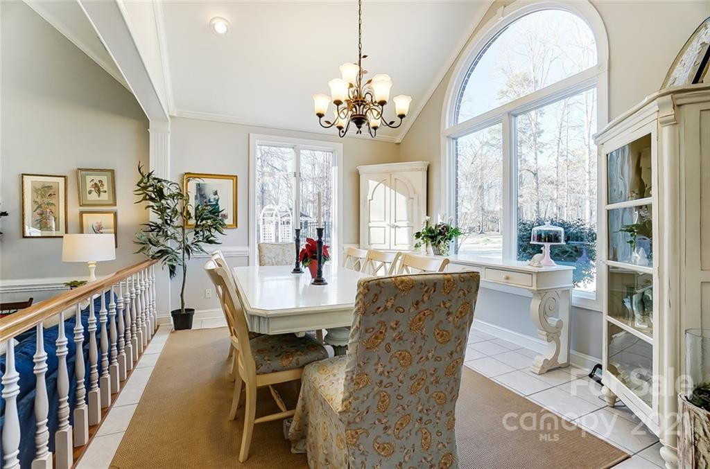 1517 Helms Shortcut Road Monroe, NC 28112 - Photo 14 of 45 a view of a dining room with furniture a chandelier and wooden floor