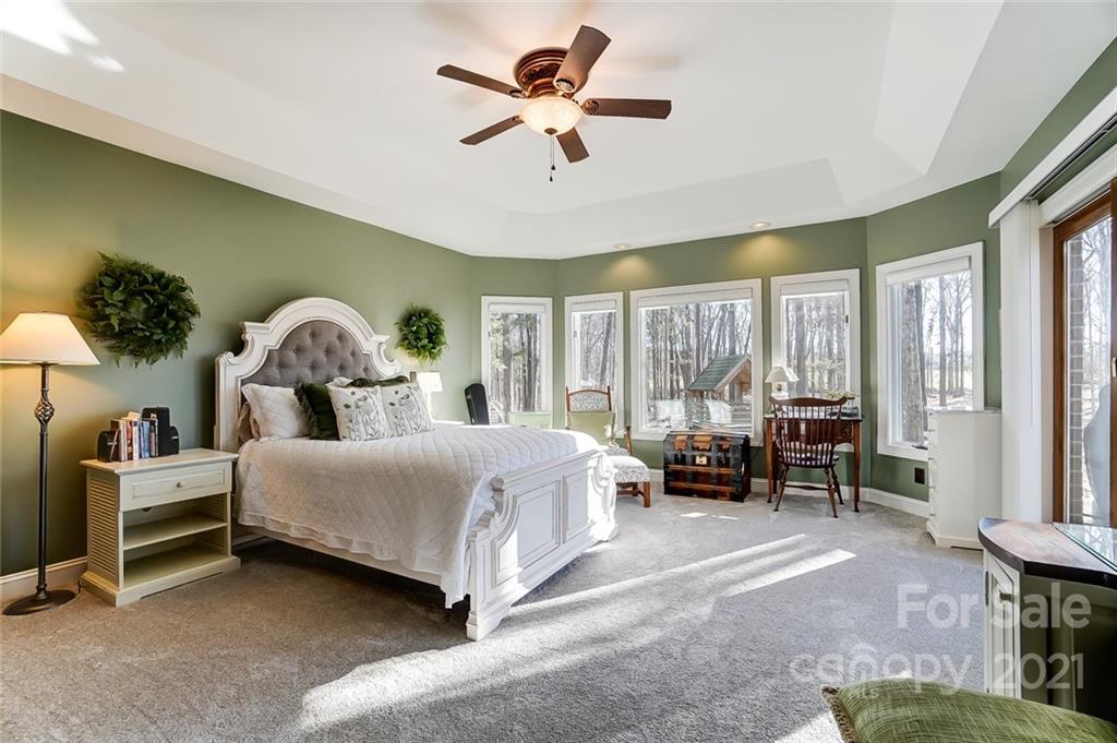 1517 Helms Shortcut Road Monroe, NC 28112 - Photo 15 of 45 a bedroom with a bed couch and a large window