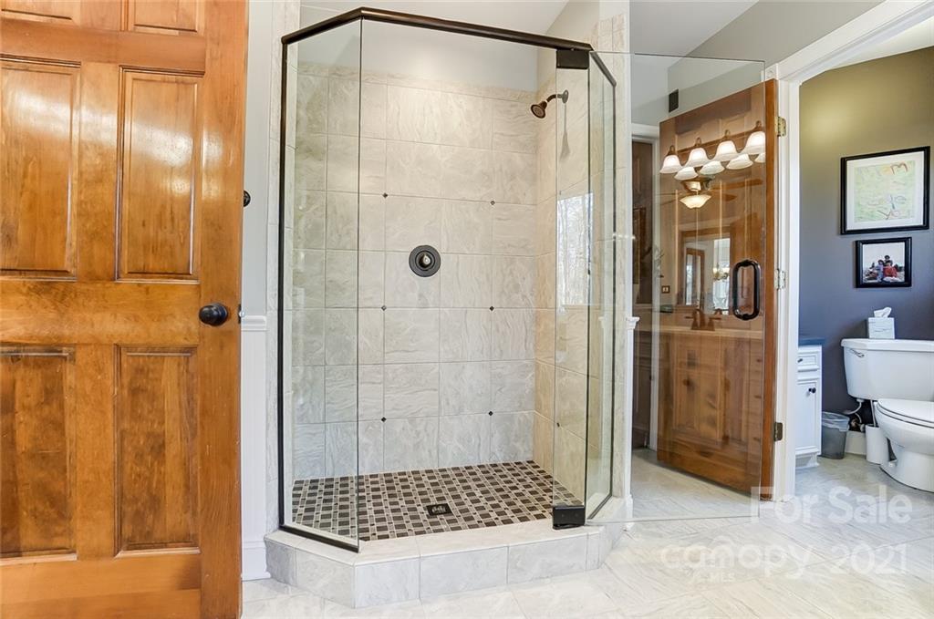 1517 Helms Shortcut Road Monroe, NC 28112 - Photo 19 of 45 a bathroom with a glass shower door
