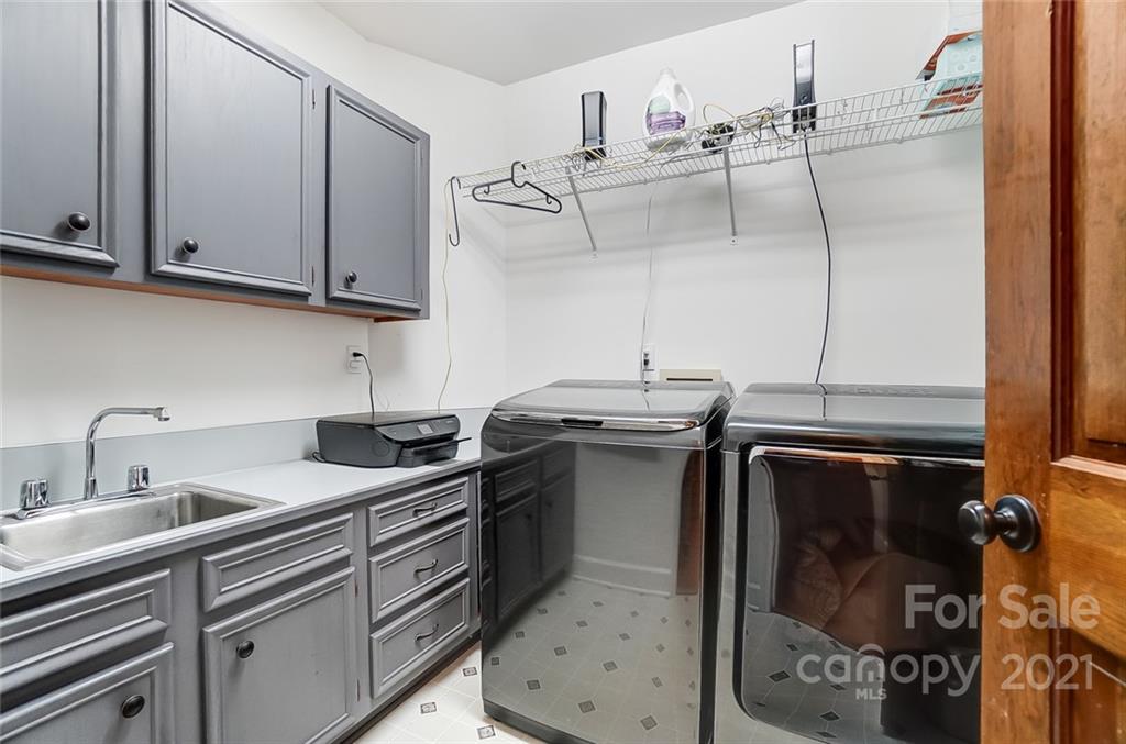 1517 Helms Shortcut Road Monroe, NC 28112 - Photo 20 of 45 a kitchen with stainless steel appliances granite countertop a sink a stove and cabinets