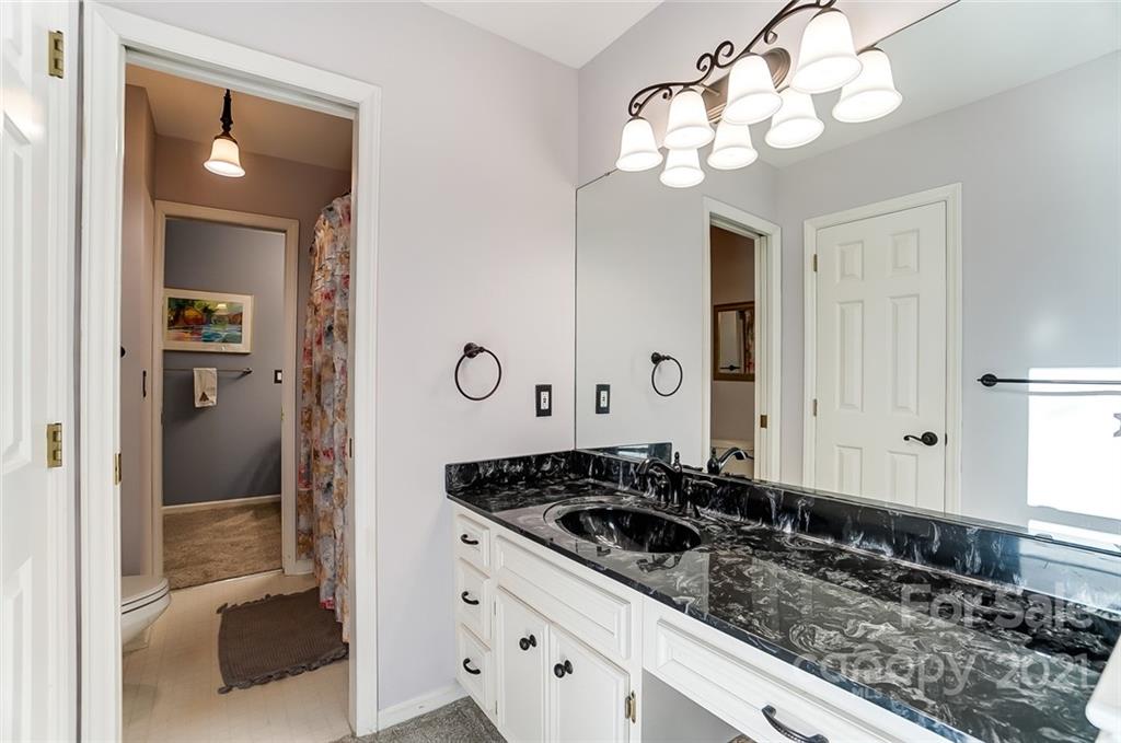 1517 Helms Shortcut Road Monroe, NC 28112 - Photo 27 of 45 a bathroom with a sink and a mirror