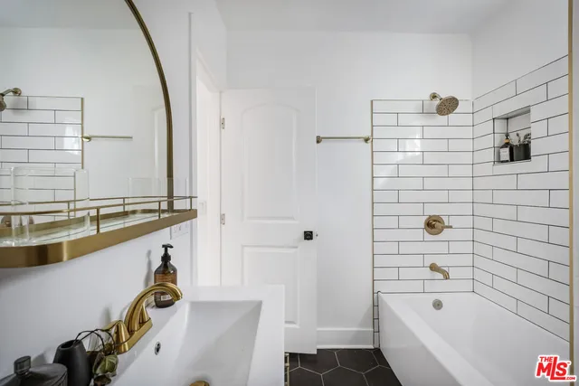 a bathroom with a bathtub and a sink