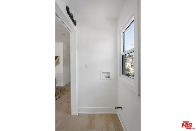 a picture of a room with a door and a hallway
