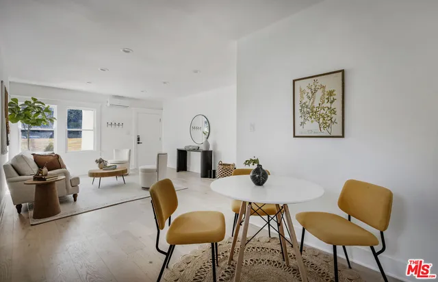a view of a livingroom with furniture and a dining room