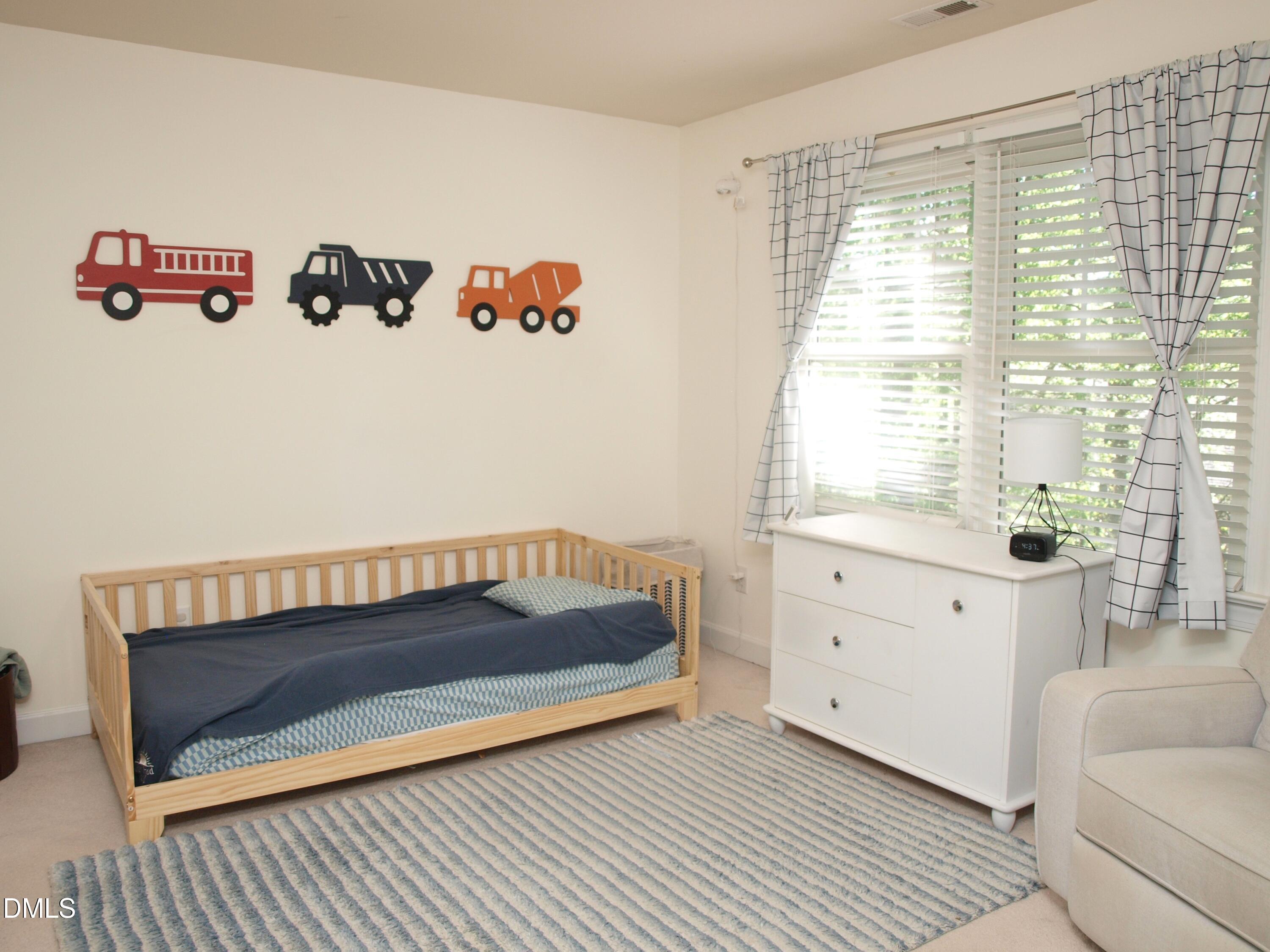 5206 Rio Grande Drive Raleigh, NC 27616 - Photo 25 of 37 a view of bedroom with wooden floor and white walls