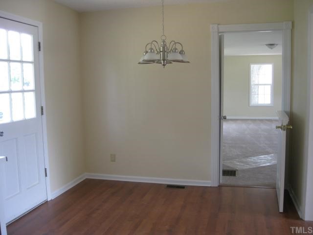 602 River Road Selma, NC 27576 - Photo 5 of 6 Eat in area - new paint, new laminate flooring. New kit island has been installed. Looking into living room from kitchen.New laminate flooring.