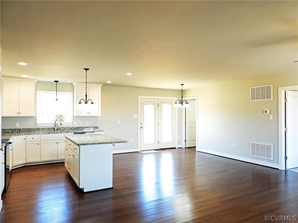 4608 Pin Oak Road Prospect, VA 23960 - Photo 11 of 29 a kitchen with granite countertop a stove top oven sink and cabinets