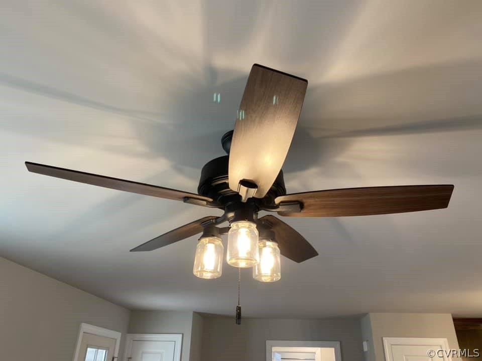 4608 Pin Oak Road Prospect, VA 23960 - Photo 13 of 29 a view of a hallway with a chandelier fan and wooden floor