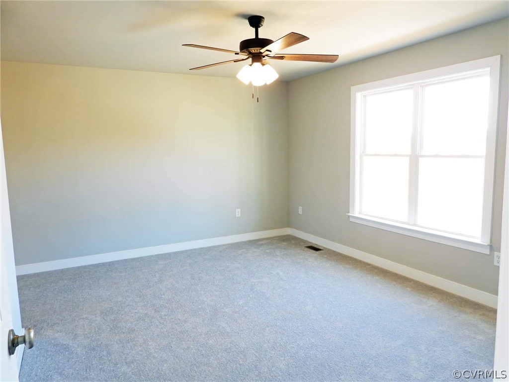 4608 Pin Oak Road Prospect, VA 23960 - Photo 18 of 29 an empty room with a window and a fan