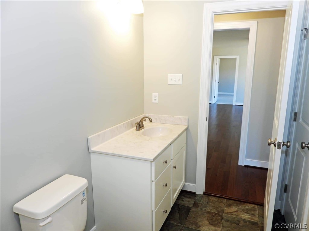4608 Pin Oak Road Prospect, VA 23960 - Photo 19 of 29 a bathroom with a toilet sink and mirror