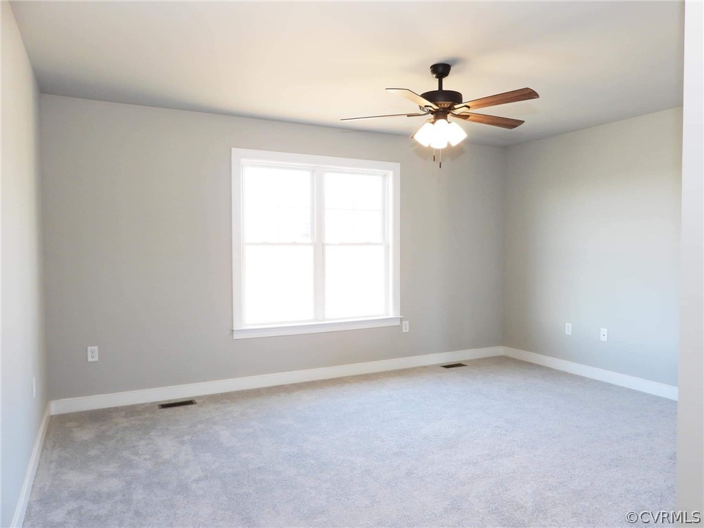 4608 Pin Oak Road Prospect, VA 23960 - Photo 24 of 29 an empty room with a window and a fan