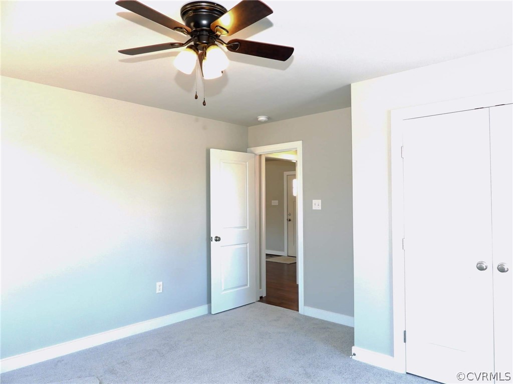 4608 Pin Oak Road Prospect, VA 23960 - Photo 26 of 29 an empty room with closet and chandelier fan
