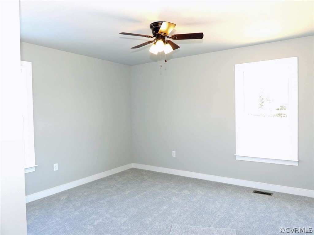 4608 Pin Oak Road Prospect, VA 23960 - Photo 27 of 29 an empty room with a window and a fan