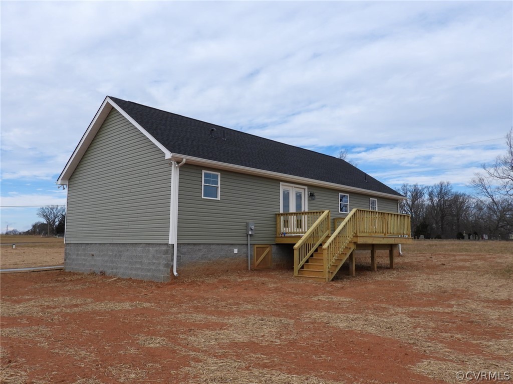 4608 Pin Oak Road Prospect, VA 23960 - Photo 3 of 29 a backyard of a house with wooden fence and a bench