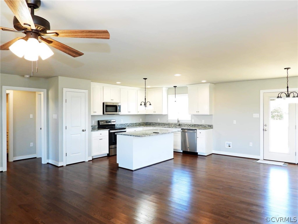 4608 Pin Oak Road Prospect, VA 23960 - Photo 9 of 29 a kitchen with a refrigerator and white cabinets