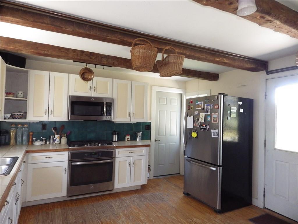 227 Guptill Road Belgrade, ME 04917 - Photo 4 of 31 Country kitchen with wood floors in...