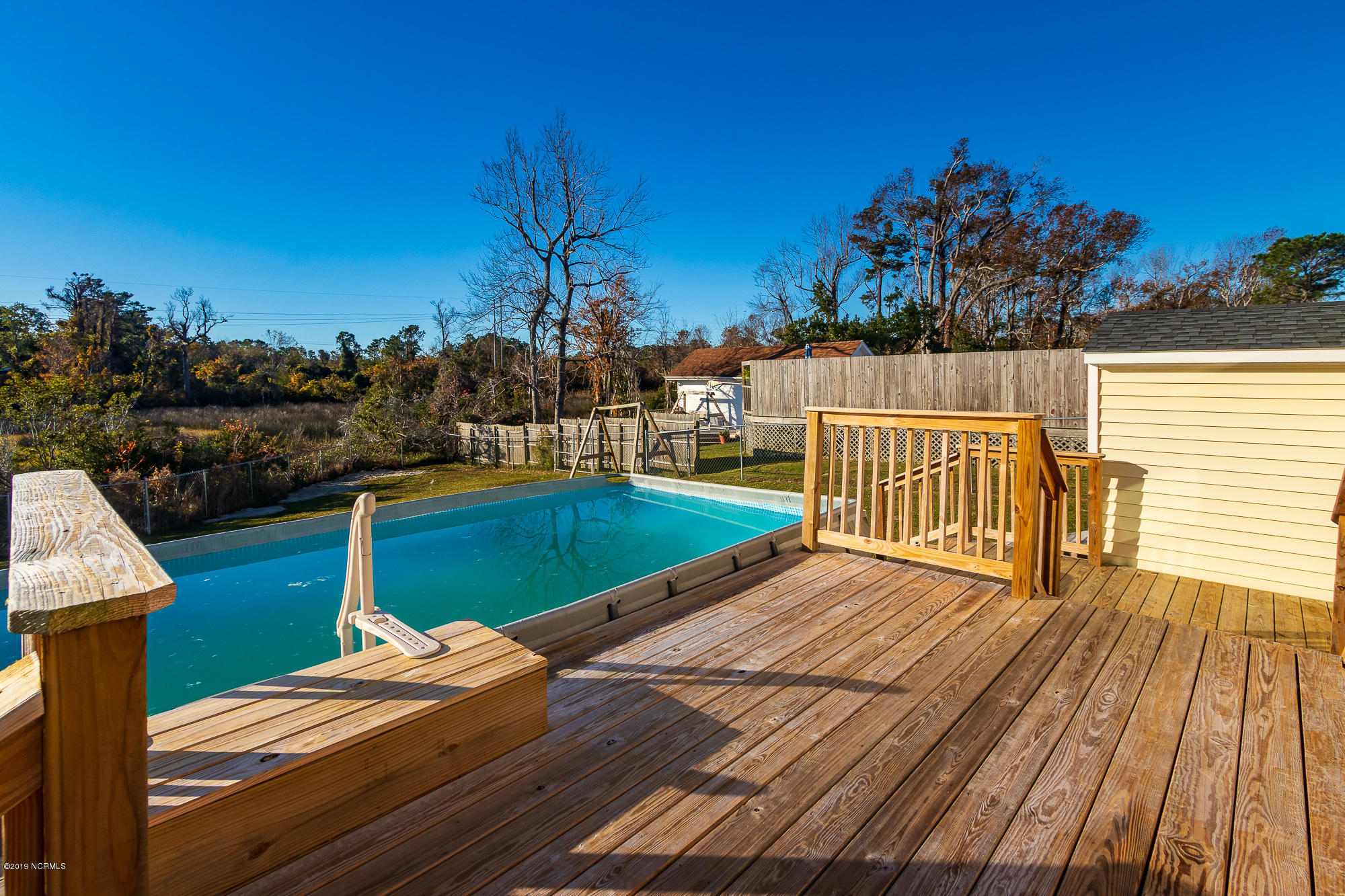 3023 Old Gate Road Morehead City, NC 28557 - Photo 7 of 39 Back deck with swimming pool