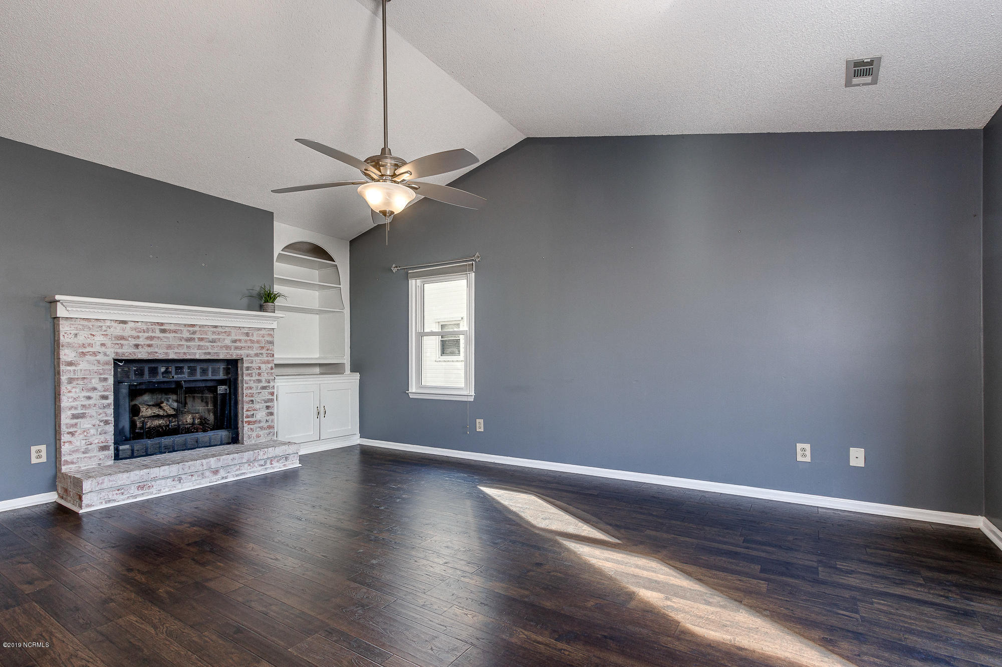 3023 Old Gate Road Morehead City, NC 28557 - Photo 9 of 39 Large living area with fireplace