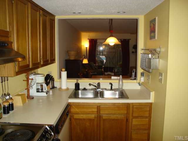 2215 Alpine Road Durham, NC 27707 - Photo 5 of 7 Second of view in kitchen with open area to dining room.