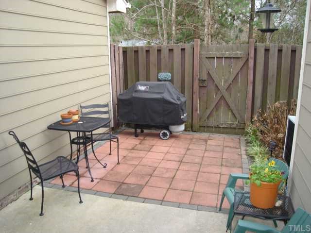 2215 Alpine Road Durham, NC 27707 - Photo 6 of 7 Great fenced in private patio. Nice retreat to outside. Storage room off patio is heated and cooled.