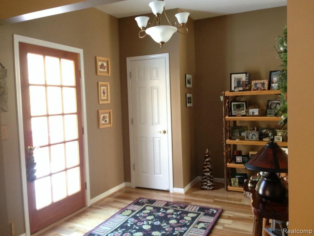 8028 McClements Road Brighton, MI 48114 - Photo 3 of 28 Beautiful foyer welcomes guests!