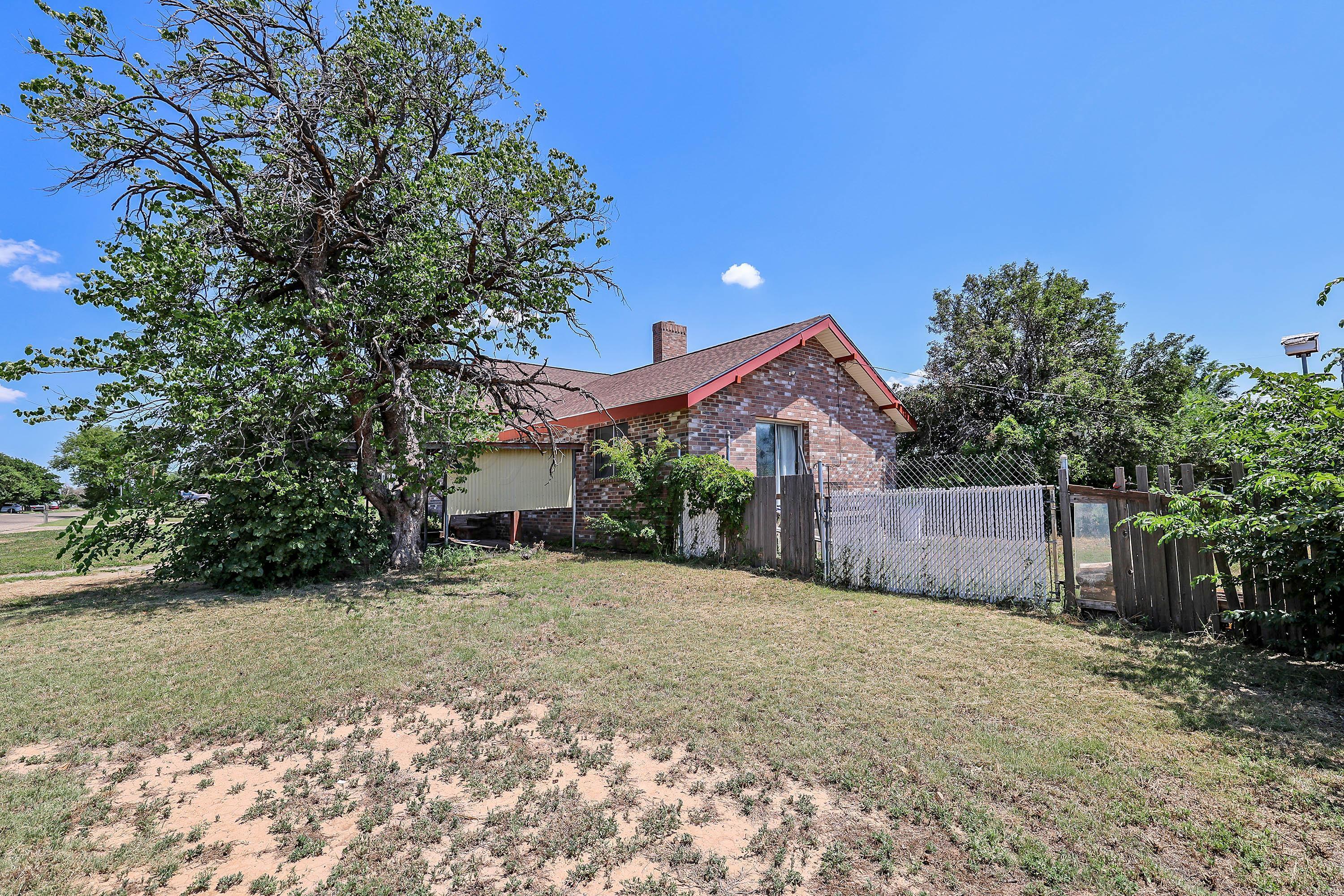 2001 Northwest 13th Avenue Amarillo, TX 79107 - Photo 2 of 35 a view of a house with a yard and tree
