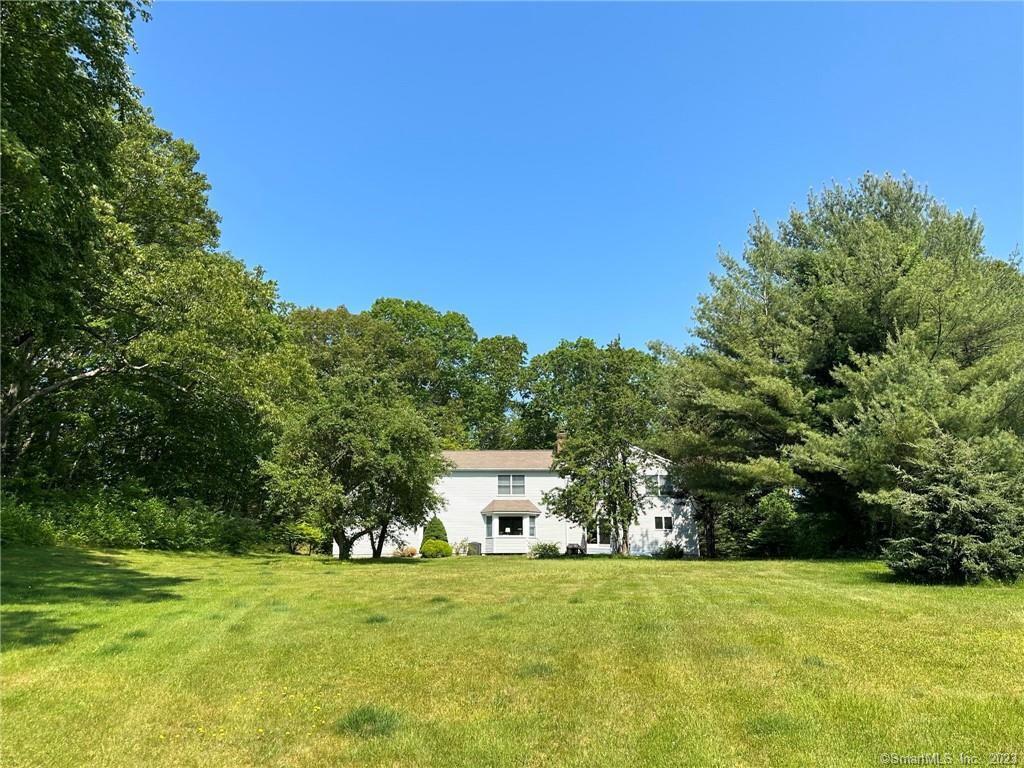 10 Hathaway Road East Lyme, CT 06333 - Photo 1 of 1 a view of a big yard with large trees