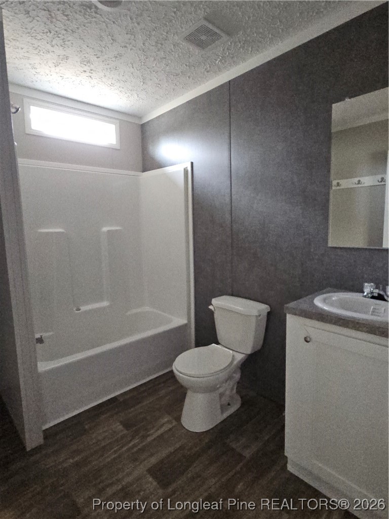1438 Twisted Hickory Road Elizabethtown, NC 28337 - Photo 12 of 15 a bathroom with a toilet and a shower