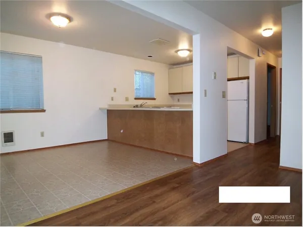 a view of kitchen with wooden floor