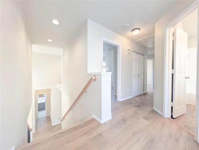 a bathroom with a sink a toilet and a large mirror