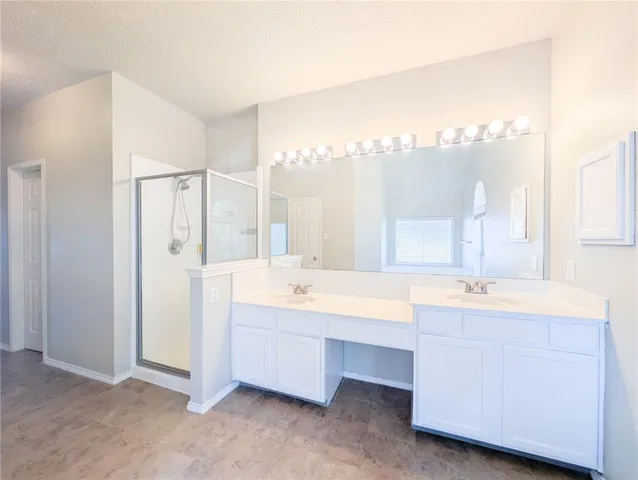a bathroom with a bathtub and a window