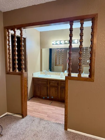 a bathroom with a double vanity sink and a mirror