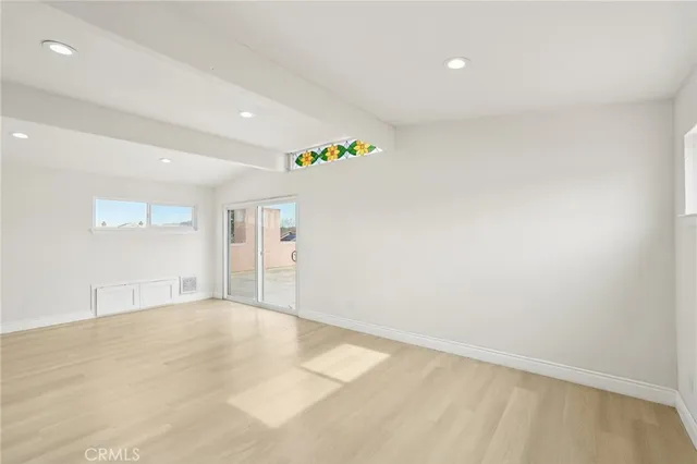 a view of a white house with a yard