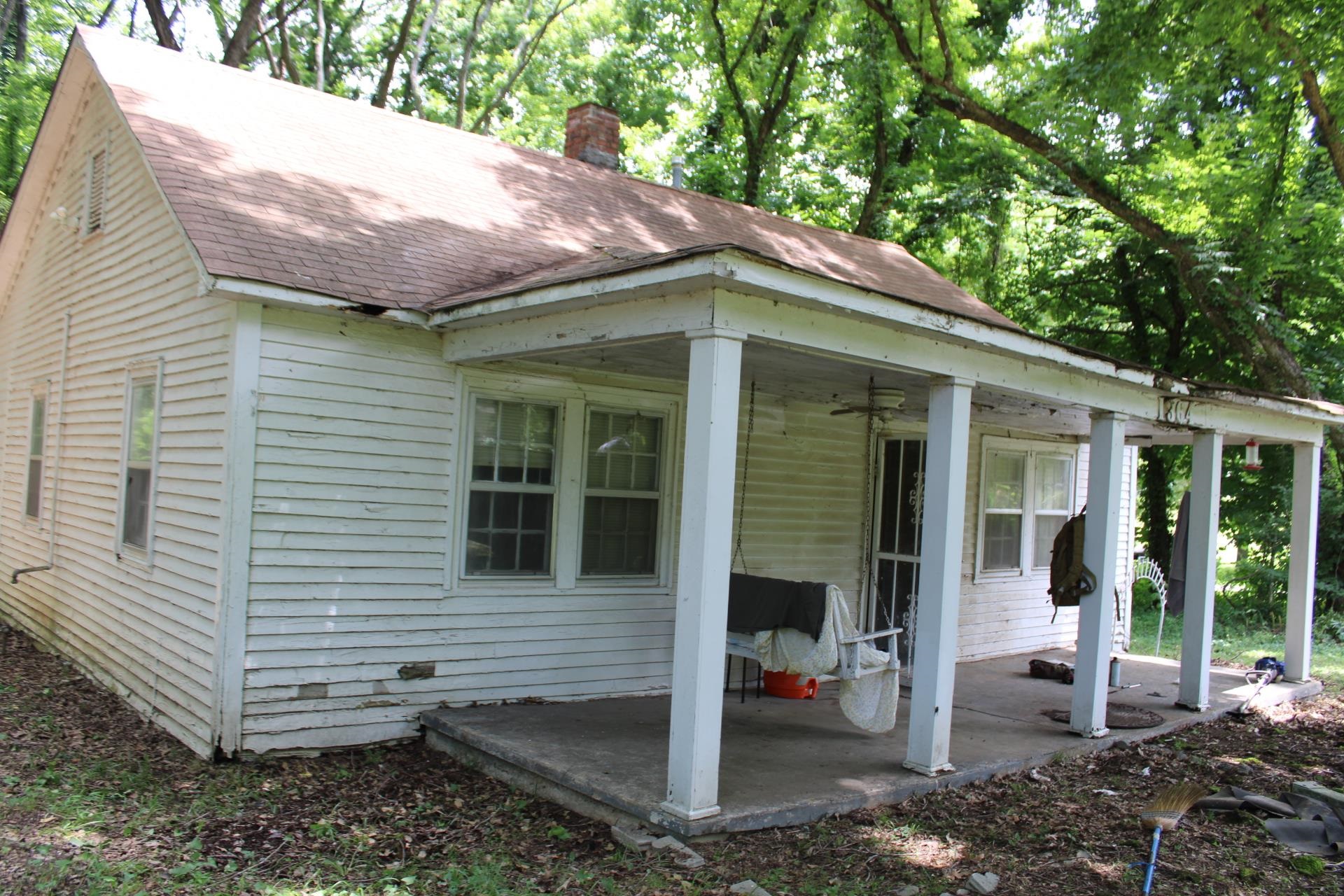 1364 Highway 59 Covington, TN 38019 - Photo 2 of 11 a view of a house with a yard and large tree
