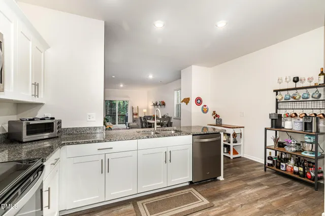 a view of a dining room with furniture and wooden floor