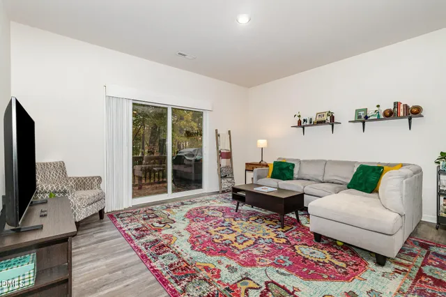 a kitchen with granite countertop a refrigerator stove and sink