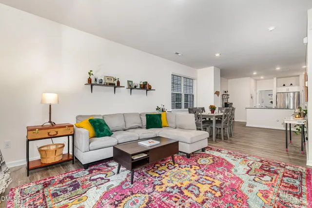 a kitchen with stainless steel appliances granite countertop a stove top oven a sink and a microwave