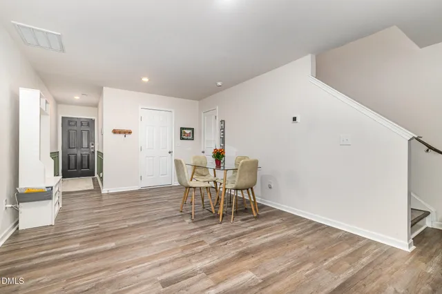 a picture of a bench in front of a wall