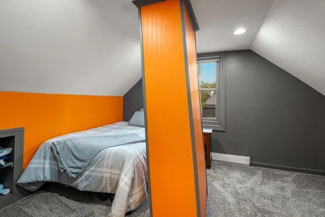 a bathroom with a granite countertop shower and a toilet