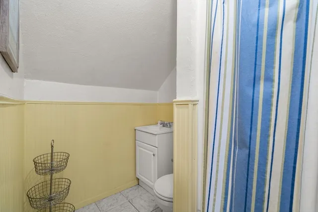 a view of a yard with a house and large trees