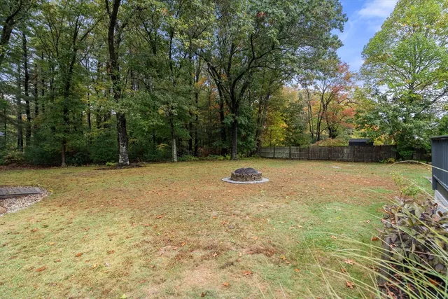 a view of a roof deck with furniture