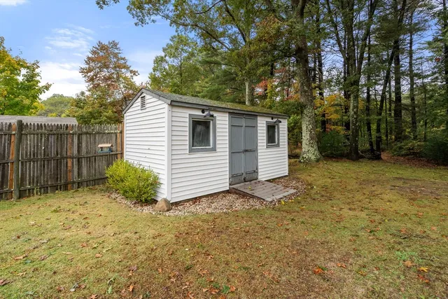 a view of a roof deck with couches and potted plants