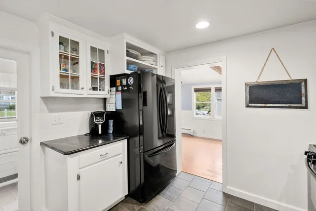 a kitchen with stainless steel appliances a refrigerator a stove a microwave and cabinets