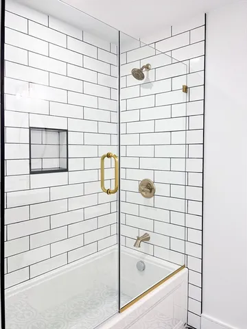 a bathroom with a shower and a bathtub