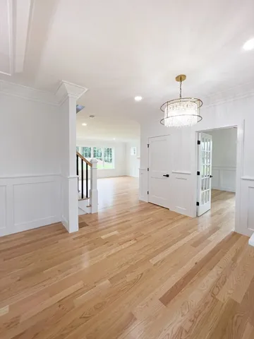 a view of an empty room and wooden floor