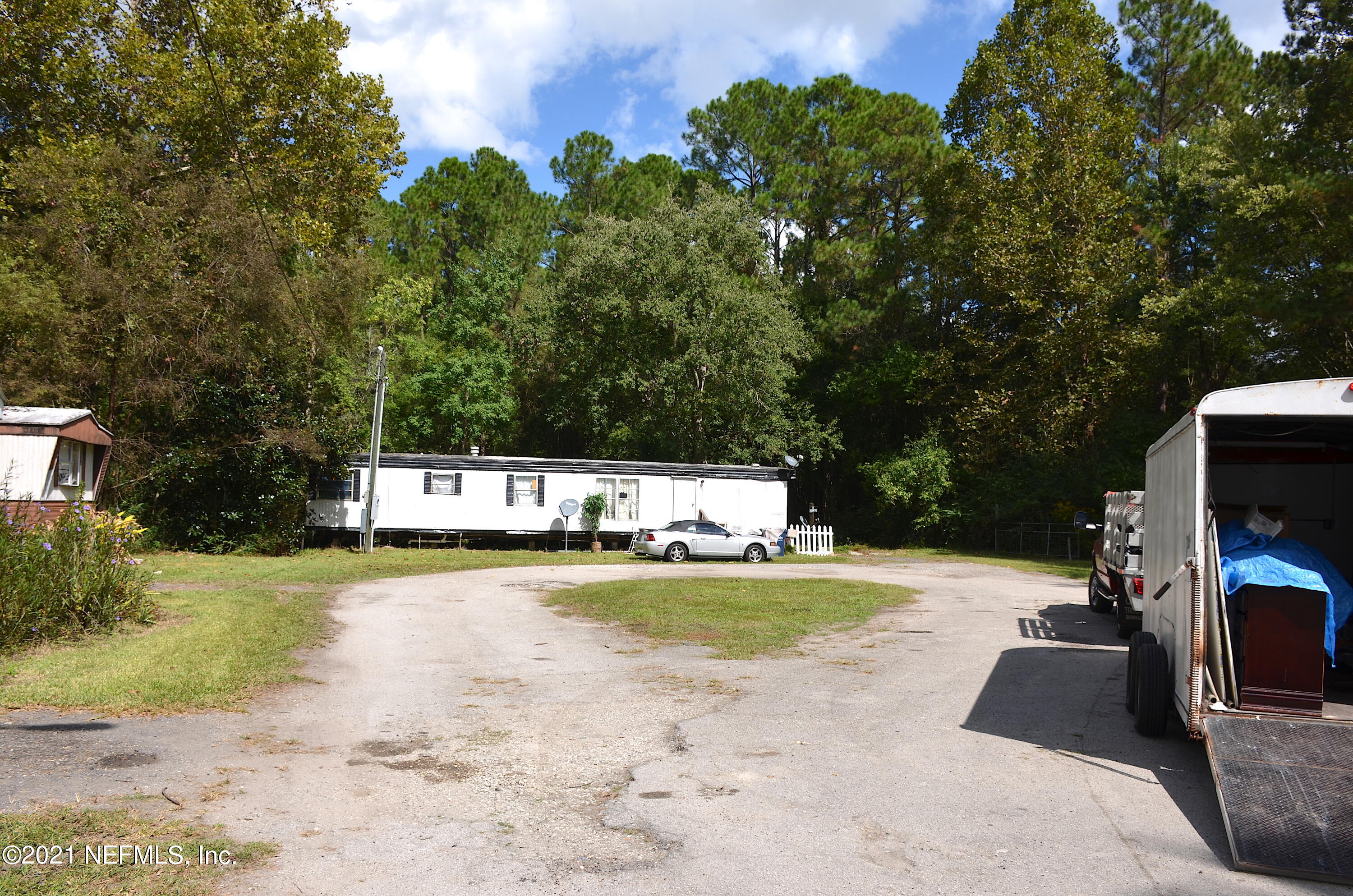 681 Rainer Road, Unit 3 Baldwin, FL 32234 - Photo 11 of 28 a view of a swimming pool with a patio