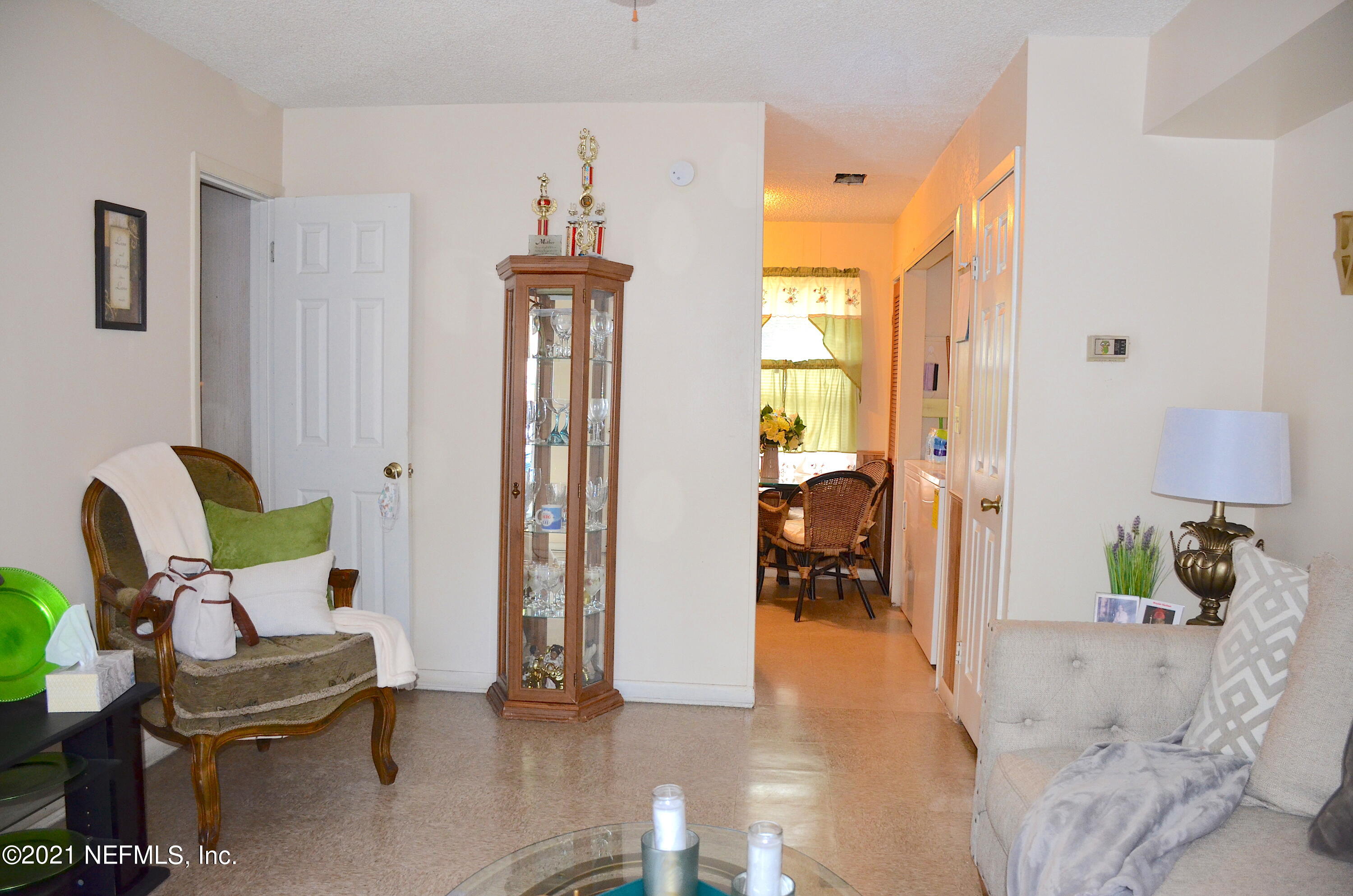 681 Rainer Road, Unit 3 Baldwin, FL 32234 - Photo 14 of 28 a living room with furniture and a window