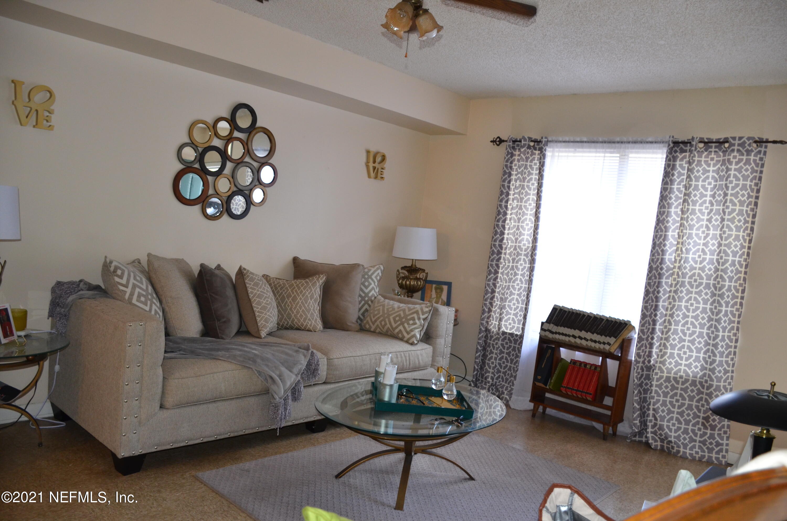 681 Rainer Road, Unit 3 Baldwin, FL 32234 - Photo 15 of 28 a living room with furniture a rug and a window