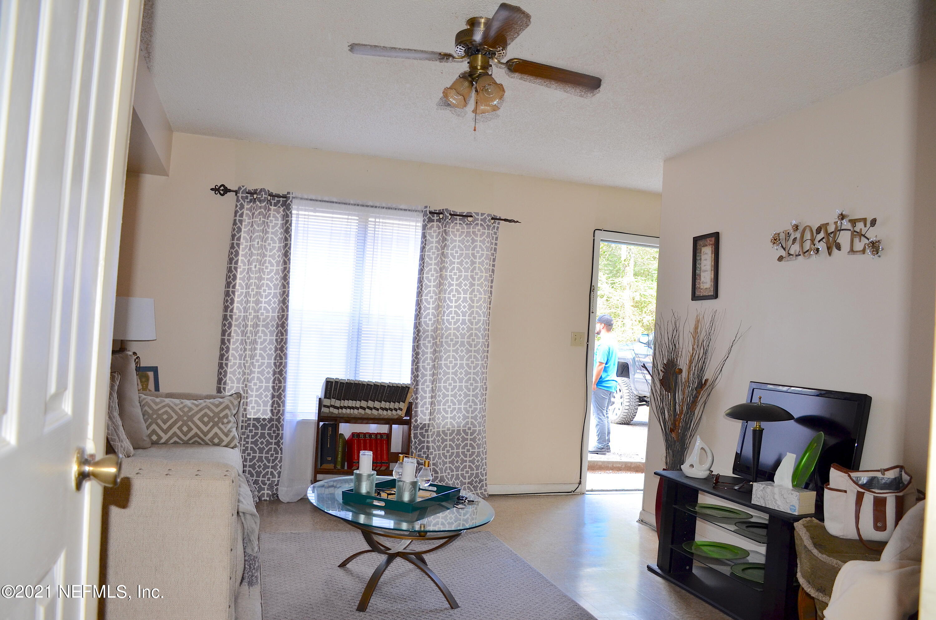681 Rainer Road, Unit 3 Baldwin, FL 32234 - Photo 16 of 28 a living room with furniture and wooden floor
